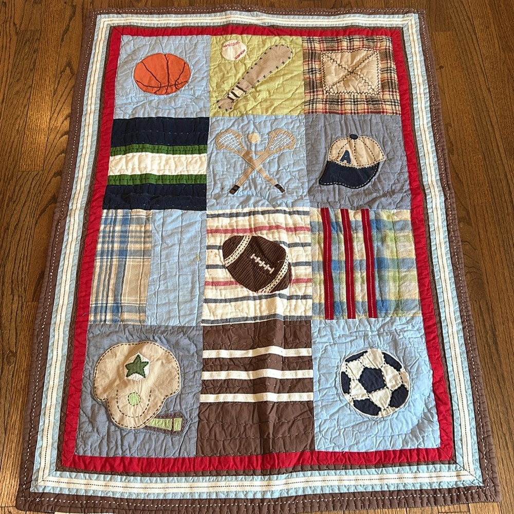 POTTERY BARN KIDS SPORTS QUILT - TODDLER BED. Used condition . 34x49 inches